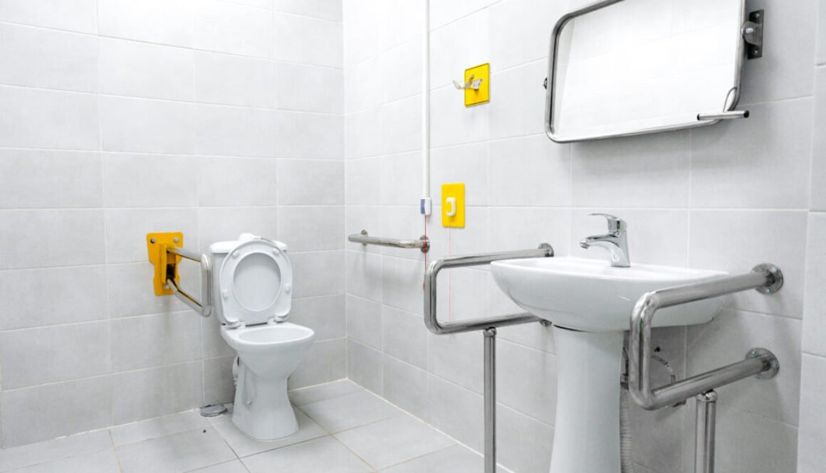 Accessible restroom with grab bars and sink