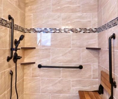 Accessible shower with grab bars and bench.