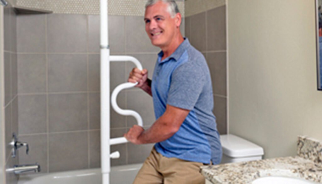 Man using safety grip inside bathroom