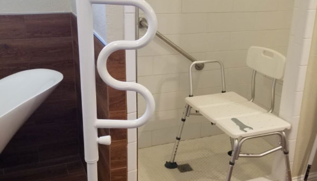 Accessible shower with grab bar and portable chair.