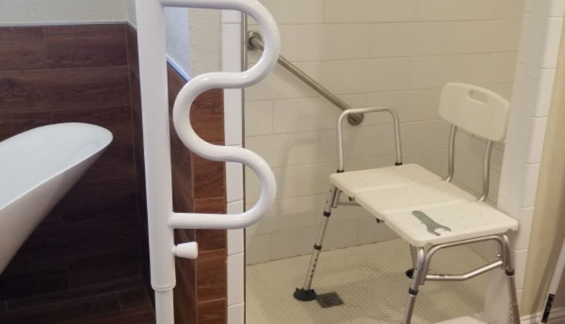 Accessible shower with grab bar and portable chair.